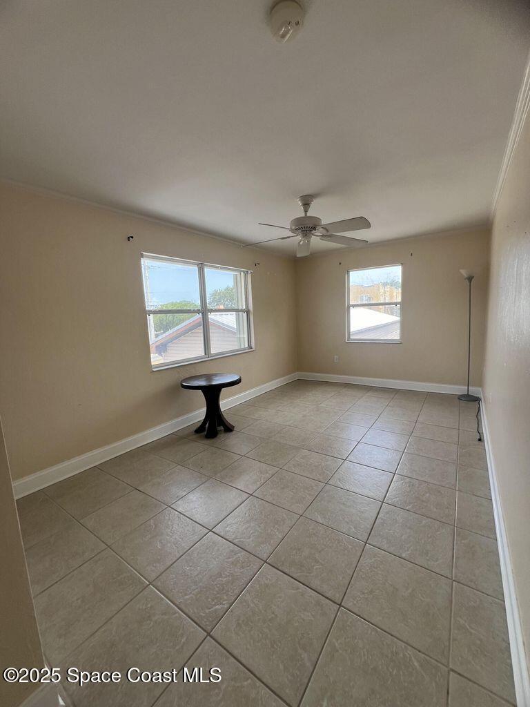 805 Forrest Avenue, Unit 4 Cocoa, FL 32922 - Photo 8 of 9 a view of an empty room with a window