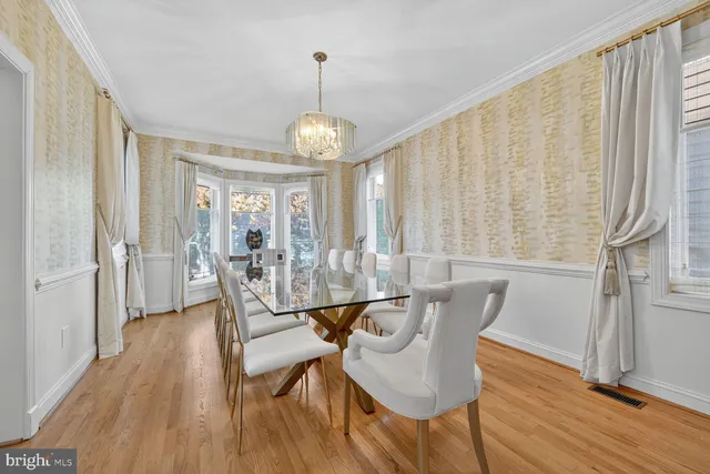 a bathroom with a toilet sink a shower and mirror