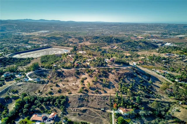 an aerial view of residential house and green space