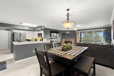 a view of a dining room with furniture wooden floor and chandelier
