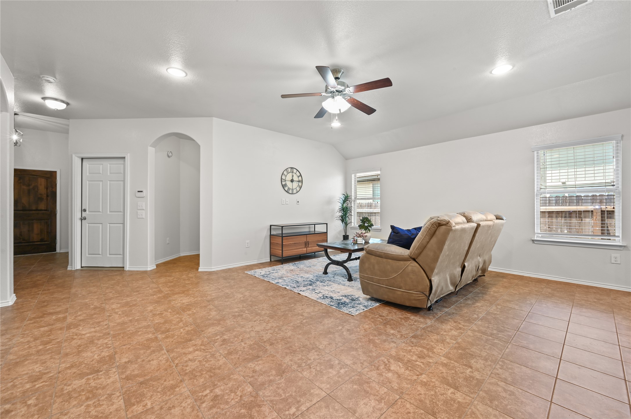 303 Limerick Road Buda, TX 78610 - Photo 3 of 23 Spacious living area featuring tile flooring and light-colored walls
