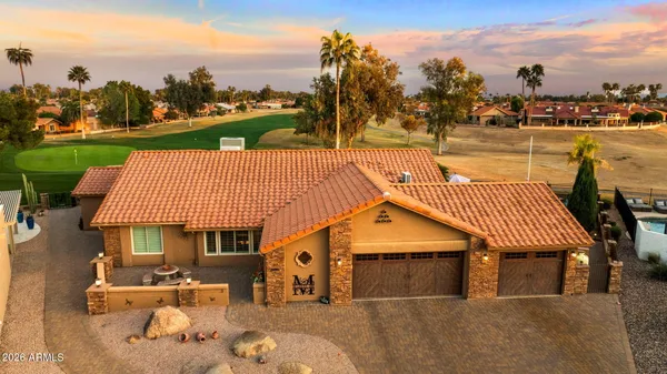 a view of a house with a yard porch and sitting area