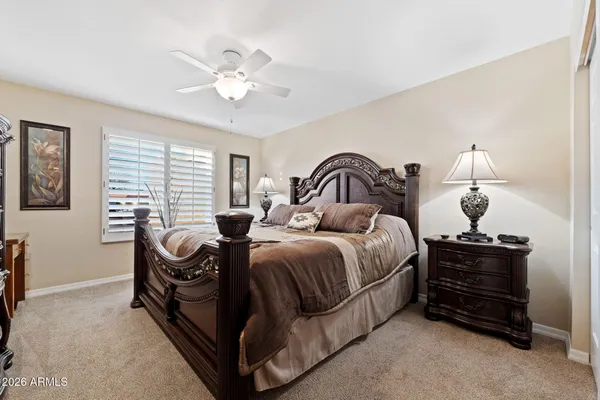 a view of a dining room with furniture wooden floor and a chandelier
