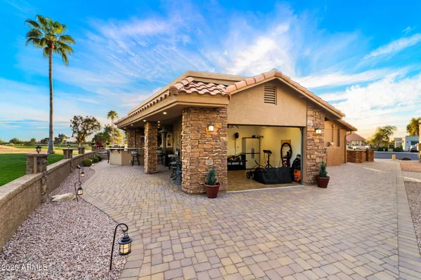 a living room with furniture a rug and a bookshelf