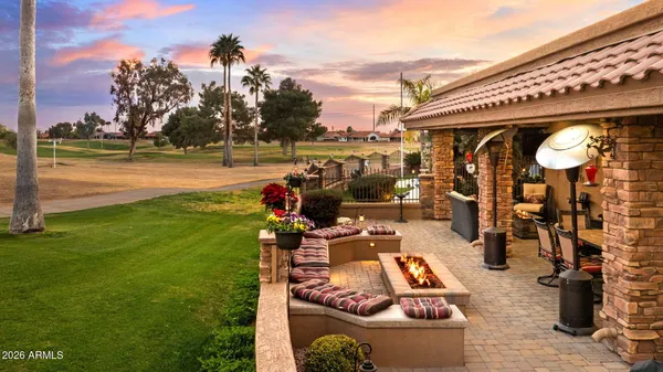 a bathroom with a sink double vanity granite and a toilet