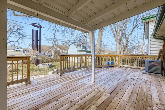 a view of a balcony with wooden floor