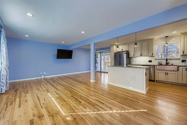 a kitchen with stainless steel appliances granite countertop a sink and cabinets