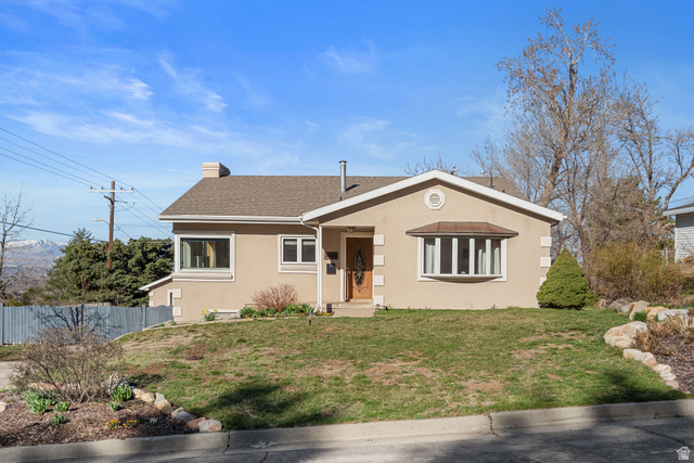 4426 South 3035 East Holladay, UT 84124 - Photo 2 of 49 View of front facade featuring stucco siding, a chimney, and roof with shingles