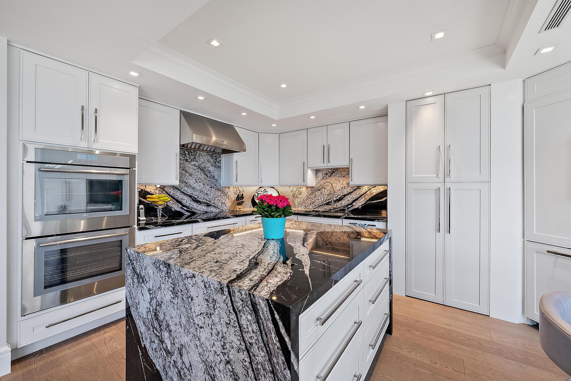 2500 South Ocean Boulevard, Unit 1 D 2 Palm Beach, FL 33480 - Photo 11 of 42 a kitchen with stainless steel appliances granite countertop a stove and a refrigerator