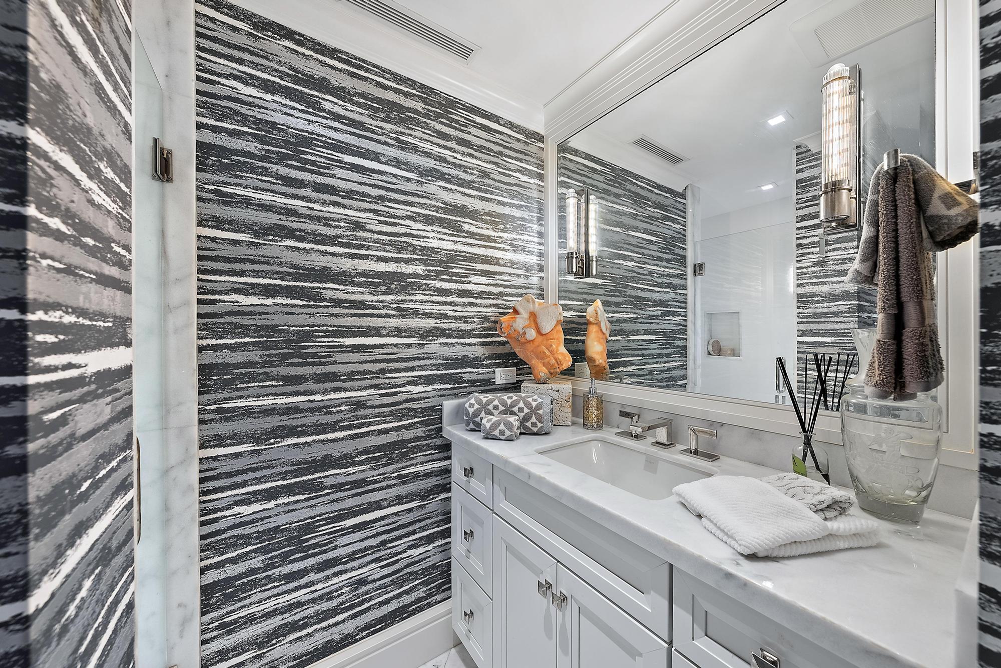 2500 South Ocean Boulevard, Unit 1 D 2 Palm Beach, FL 33480 - Photo 16 of 42 a bathroom with a sink and a mirror