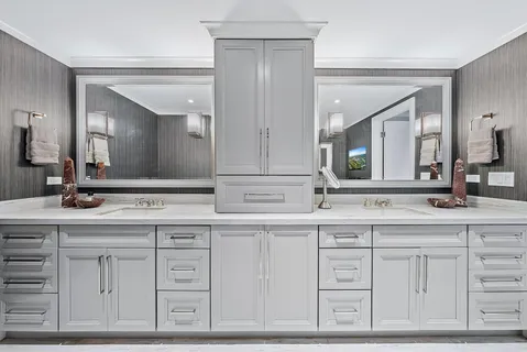 a view of a swimming pool with lawn chairs and a fire pit