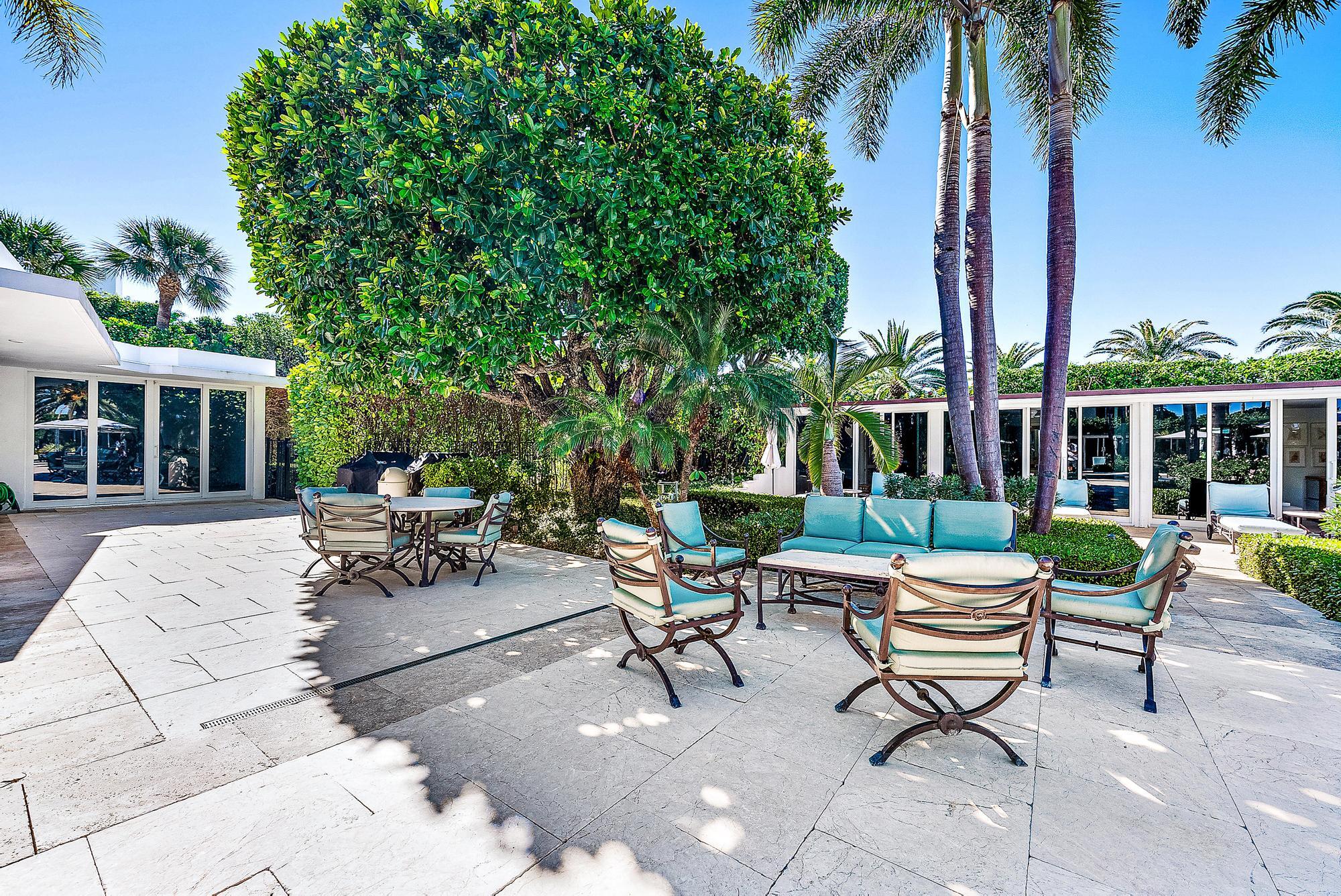 2500 South Ocean Boulevard, Unit 1 D 2 Palm Beach, FL 33480 - Photo 27 of 42 a swimming pool with outdoor seating and a garden