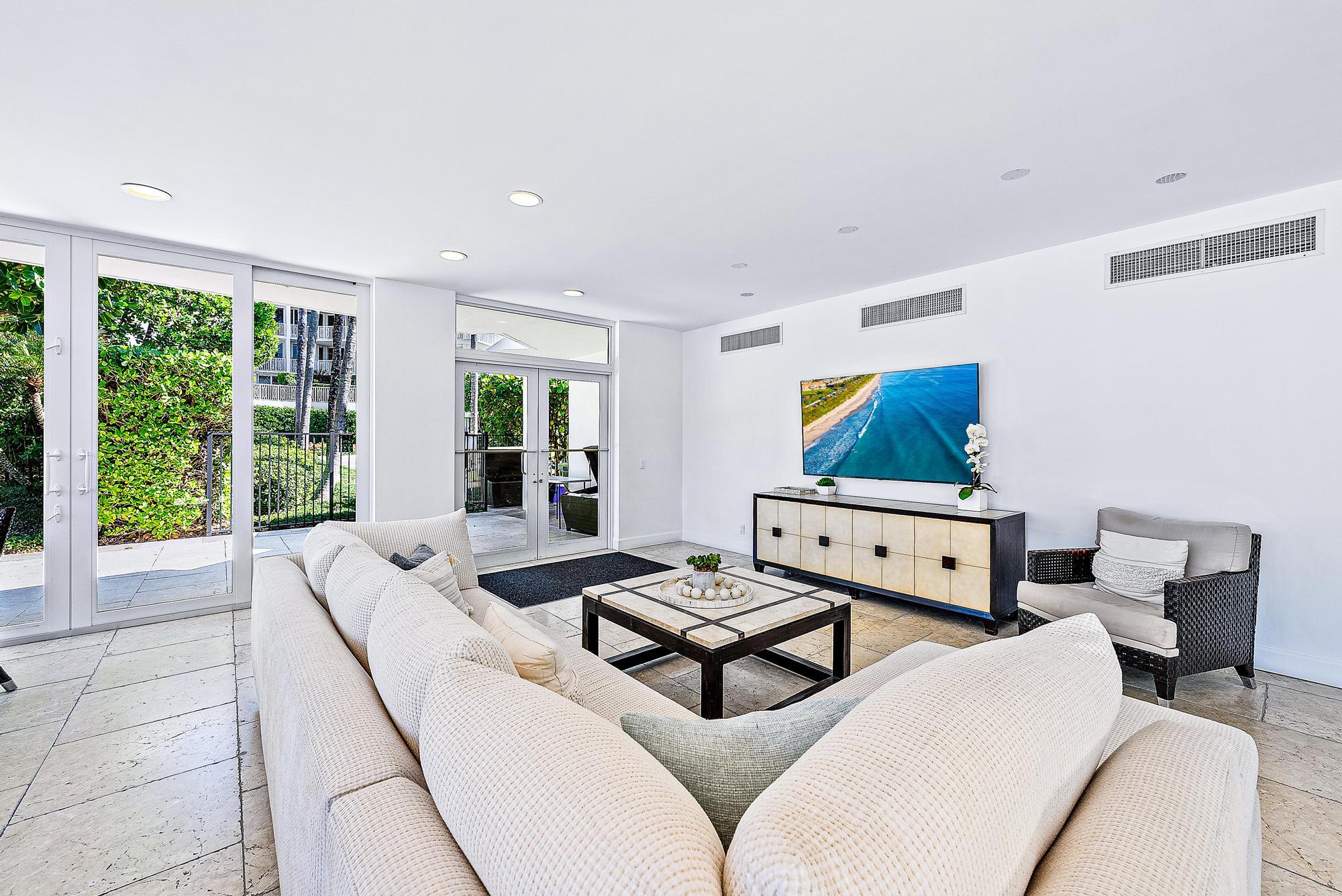 2500 South Ocean Boulevard, Unit 1 D 2 Palm Beach, FL 33480 - Photo 31 of 42 a living room with furniture and a flat screen tv