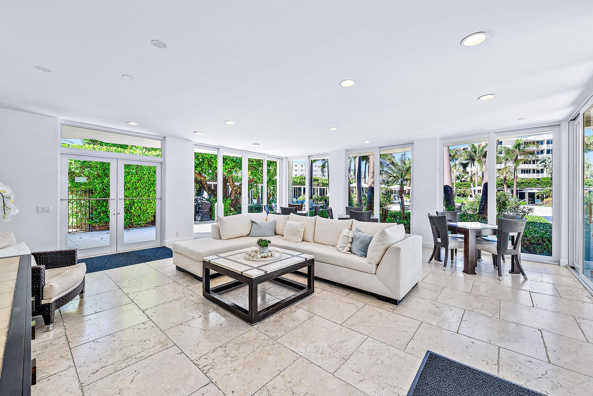 2500 South Ocean Boulevard, Unit 1 D 2 Palm Beach, FL 33480 - Photo 32 of 42 a living room with furniture and large windows with garden view