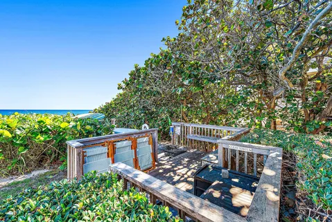 a view of a room with a table and chairs