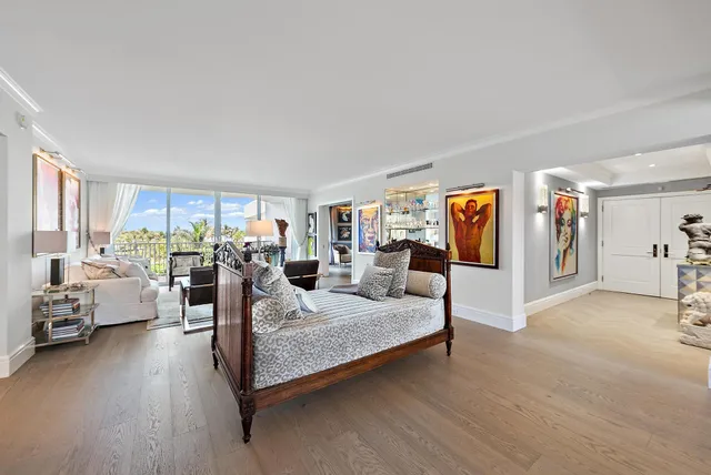 a living room with furniture fireplace and a window