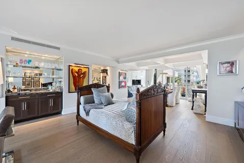 a living room with furniture a rug and a flat screen tv