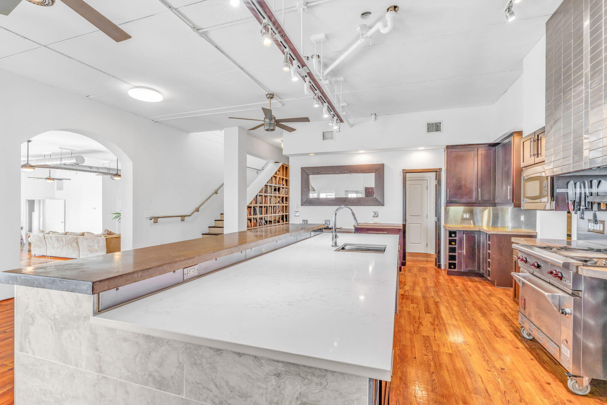 225 Colson Drive Cudjoe, FL 33042 - Photo 11 of 71 a large kitchen with stainless steel appliances granite countertop a large counter top and a stove