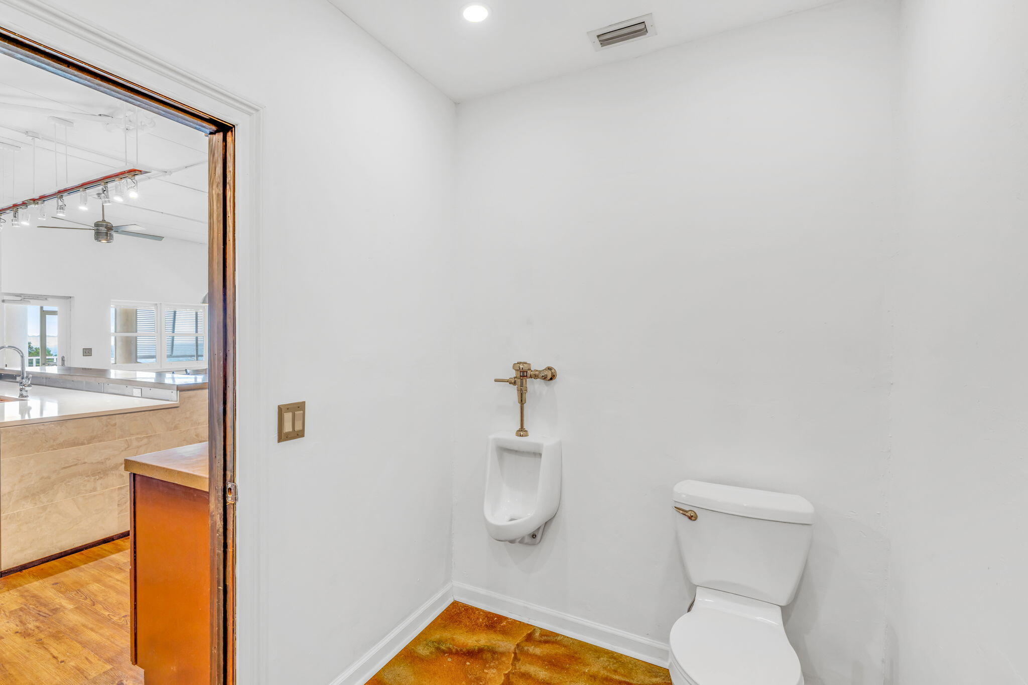 225 Colson Drive Cudjoe, FL 33042 - Photo 13 of 71 a bathroom with a toilet a sink and mirror