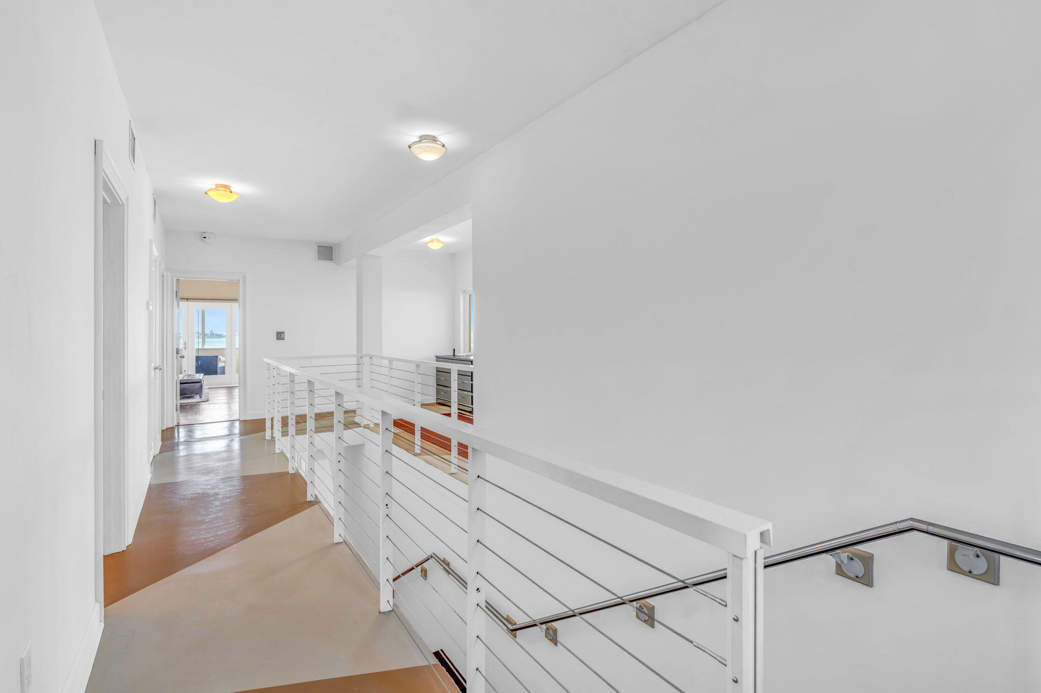 225 Colson Drive Cudjoe, FL 33042 - Photo 17 of 71 a living room with stainless steel appliances furniture a rug and a view of kitchen