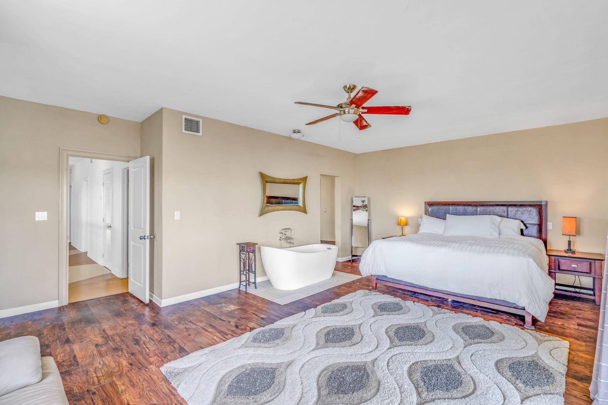 225 Colson Drive Cudjoe, FL 33042 - Photo 18 of 71 a bedroom with a bed and a painting on the wall