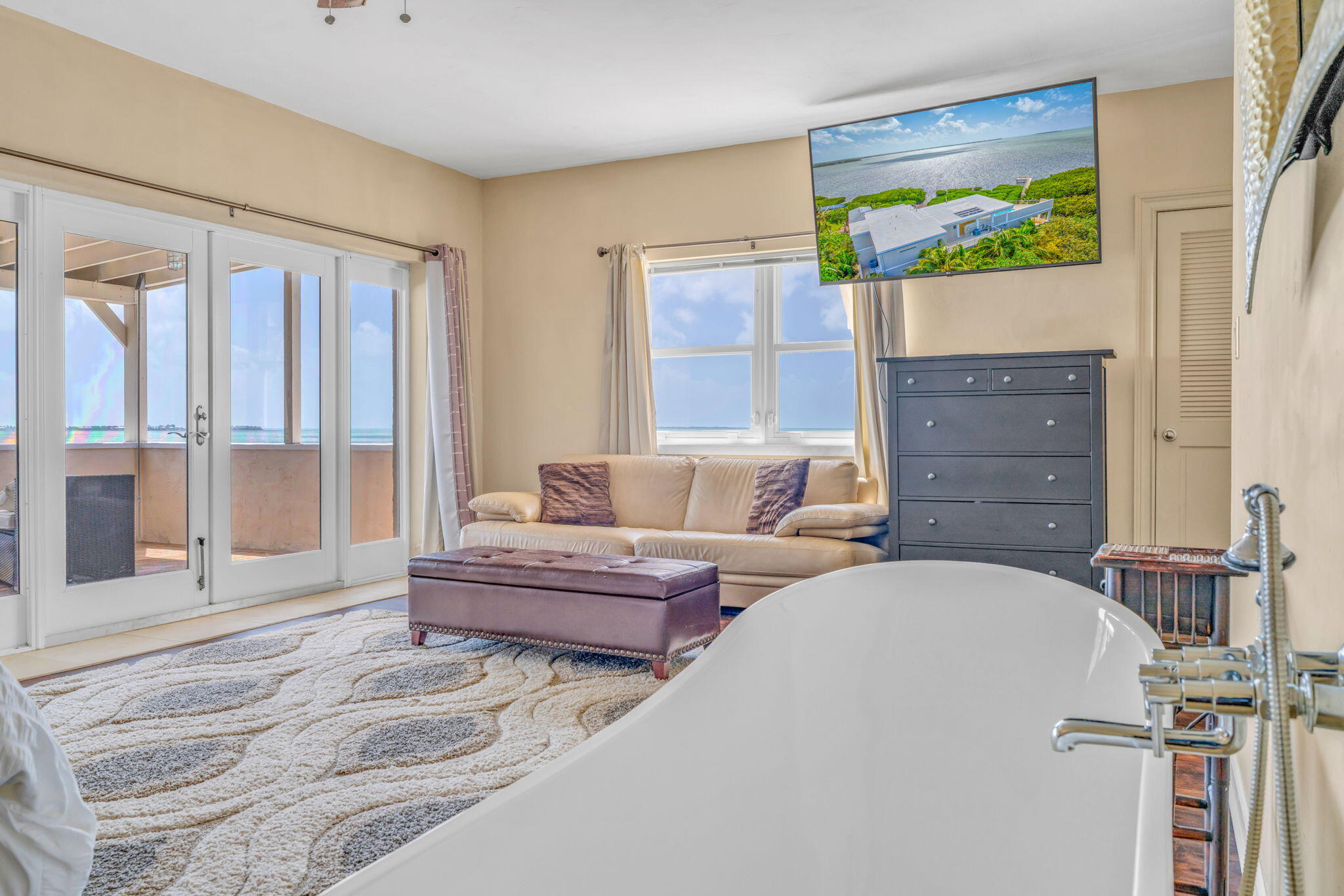 225 Colson Drive Cudjoe, FL 33042 - Photo 19 of 71 a living room with furniture and a flat screen tv