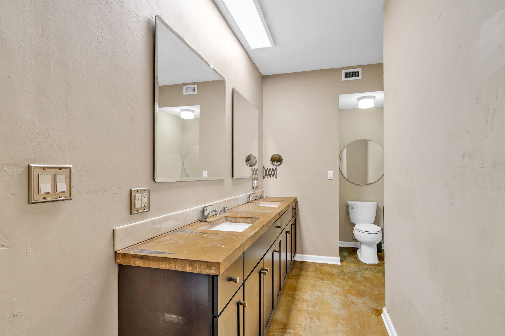 225 Colson Drive Cudjoe, FL 33042 - Photo 23 of 71 a bathroom with a sink a toilet and a mirror