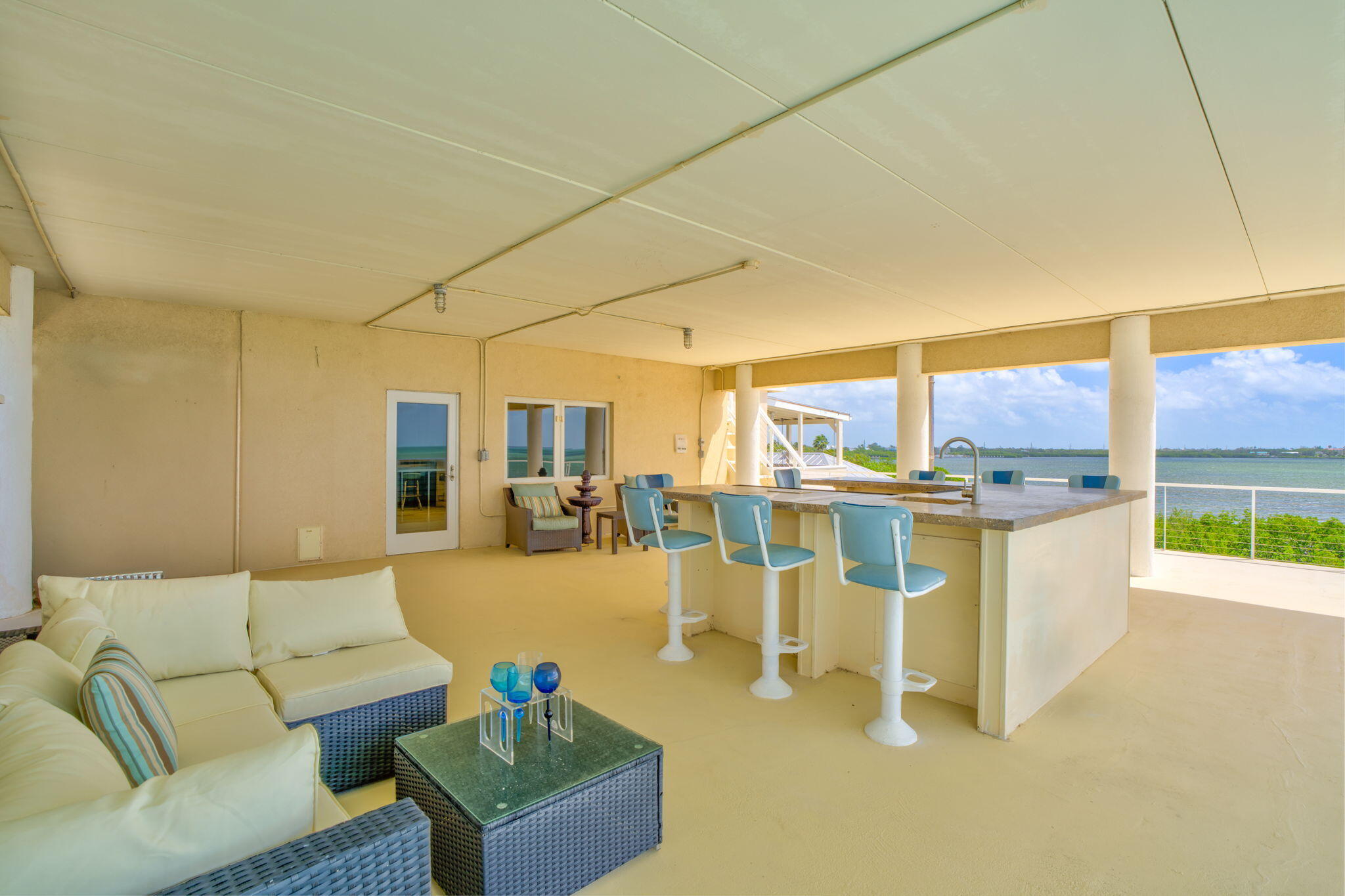 225 Colson Drive Cudjoe, FL 33042 - Photo 31 of 71 a living room with furniture and a view of kitchen