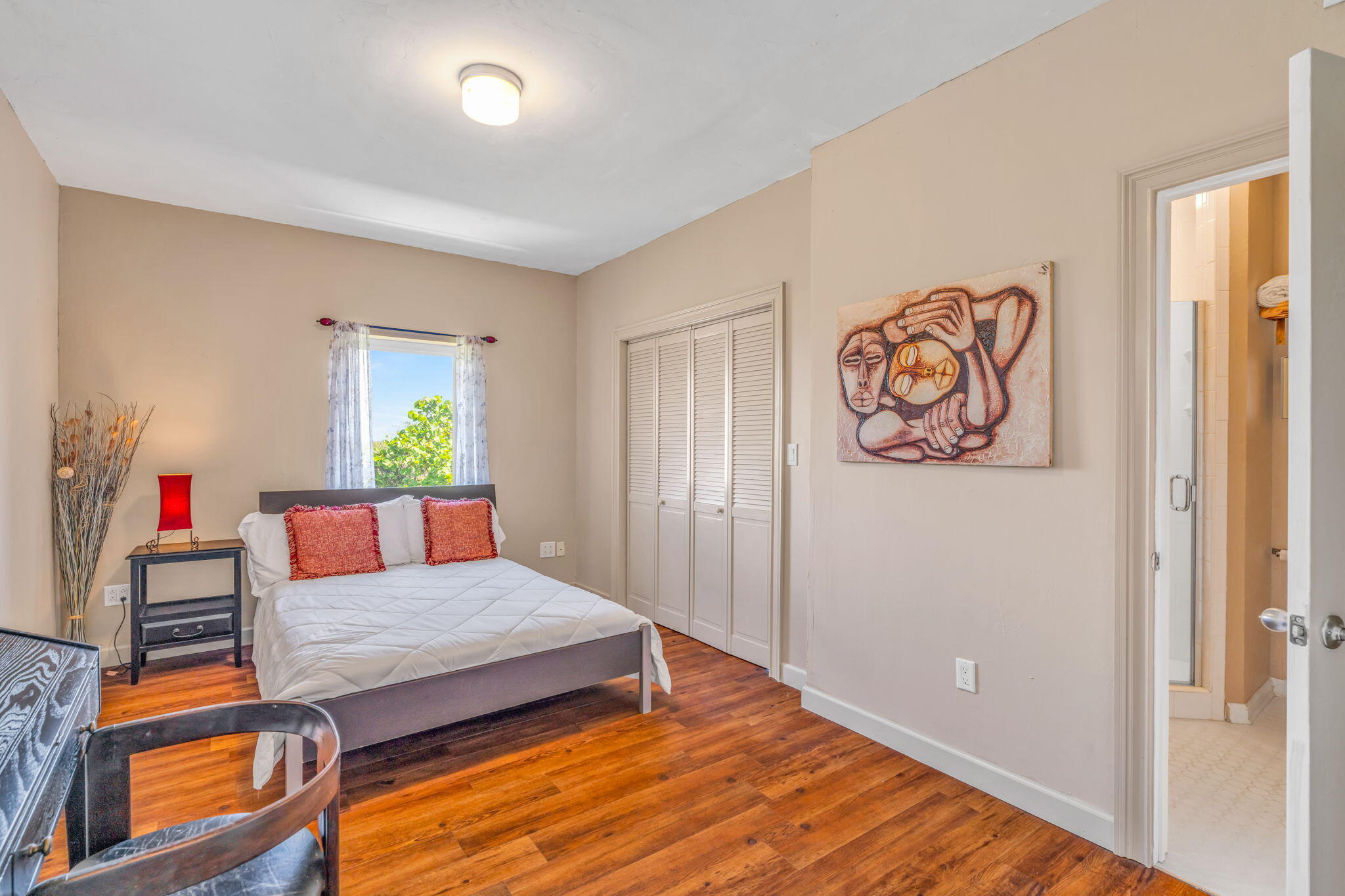 225 Colson Drive Cudjoe, FL 33042 - Photo 35 of 71 a bedroom with a bed and a painting on the wall