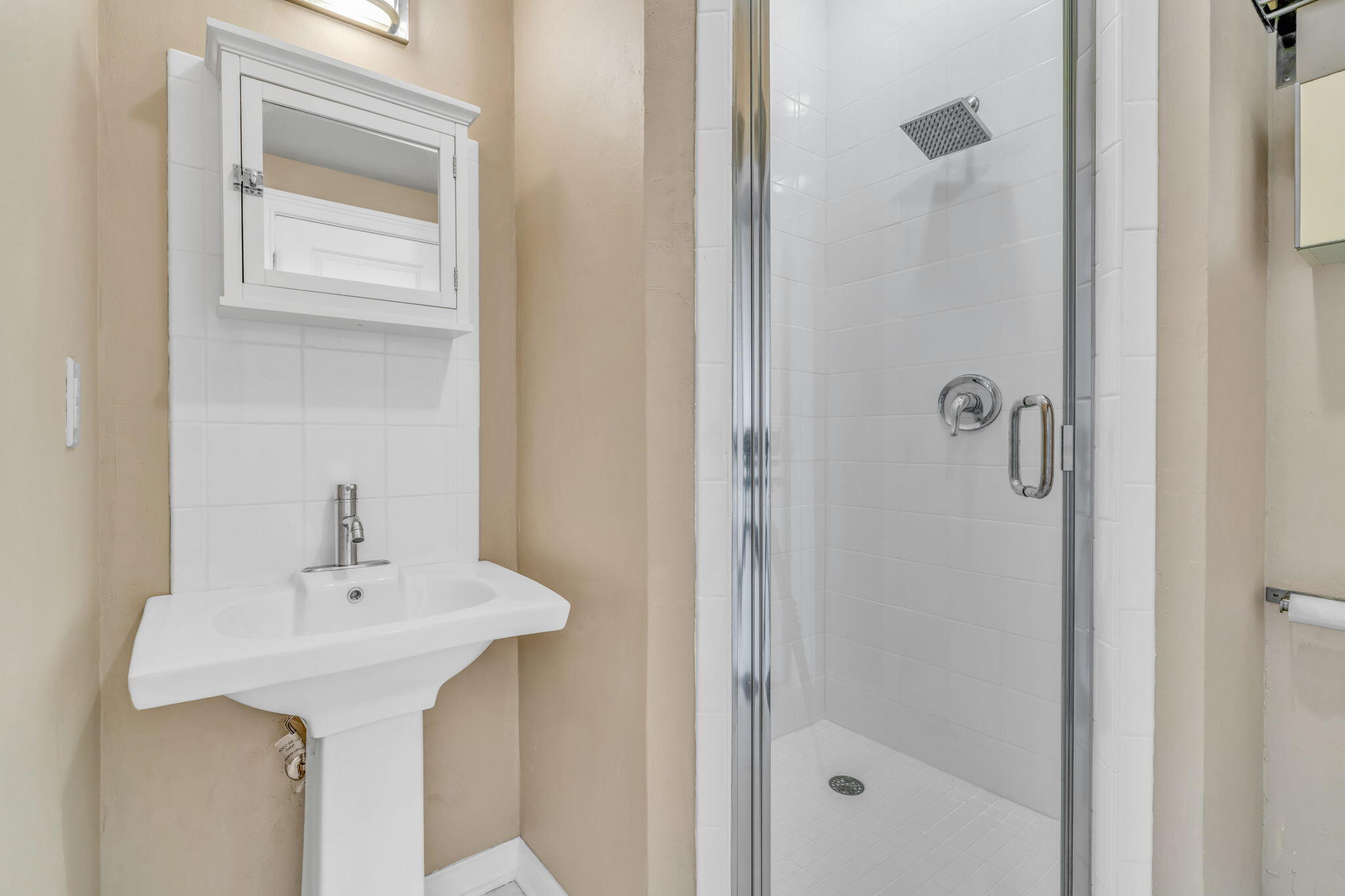 225 Colson Drive Cudjoe, FL 33042 - Photo 37 of 71 a bathroom with a sink a glass door and shower