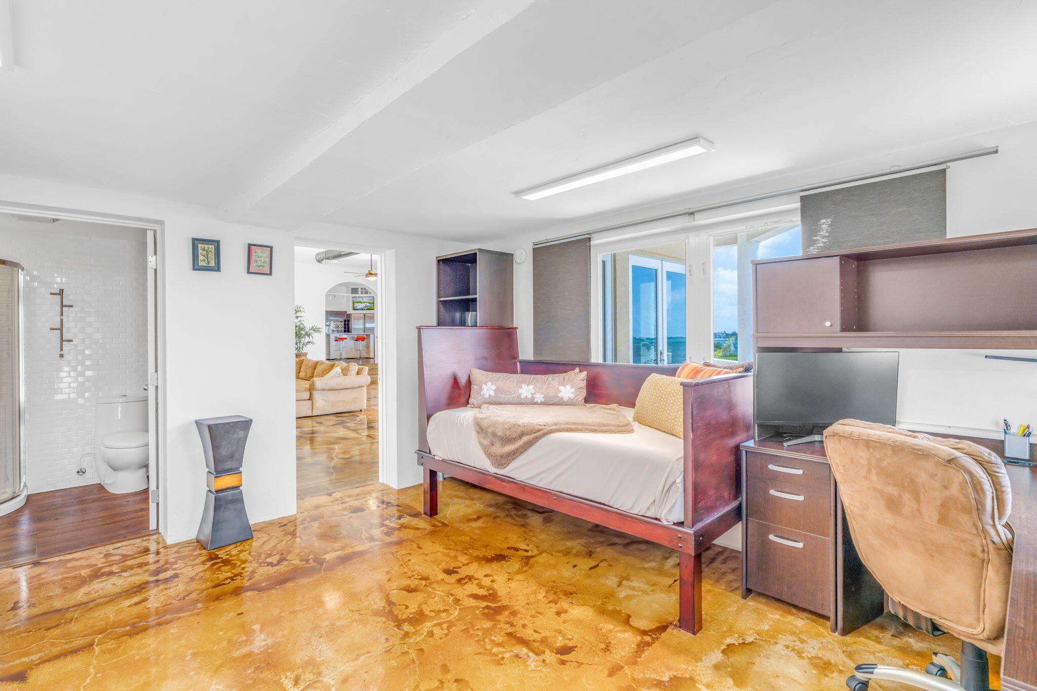 225 Colson Drive Cudjoe, FL 33042 - Photo 38 of 71 a living room with furniture and a dining table with kitchen view