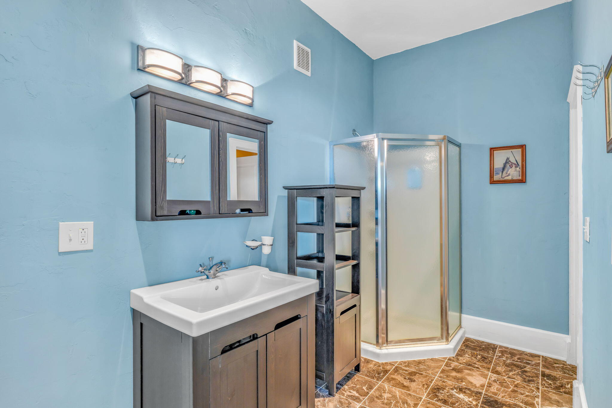 225 Colson Drive Cudjoe, FL 33042 - Photo 51 of 71 a bathroom with a sink a mirror and a shower