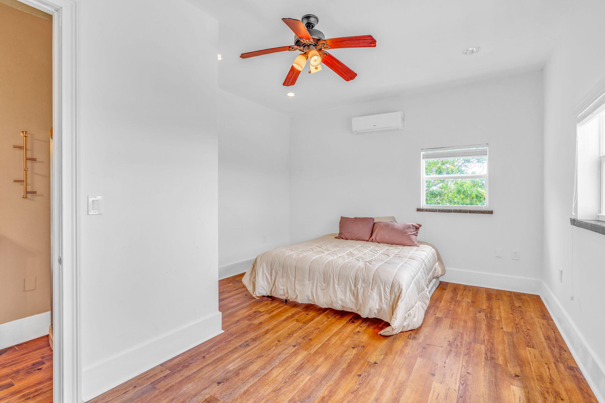 225 Colson Drive Cudjoe, FL 33042 - Photo 52 of 71 a bedroom with a bed and a painting on the wall