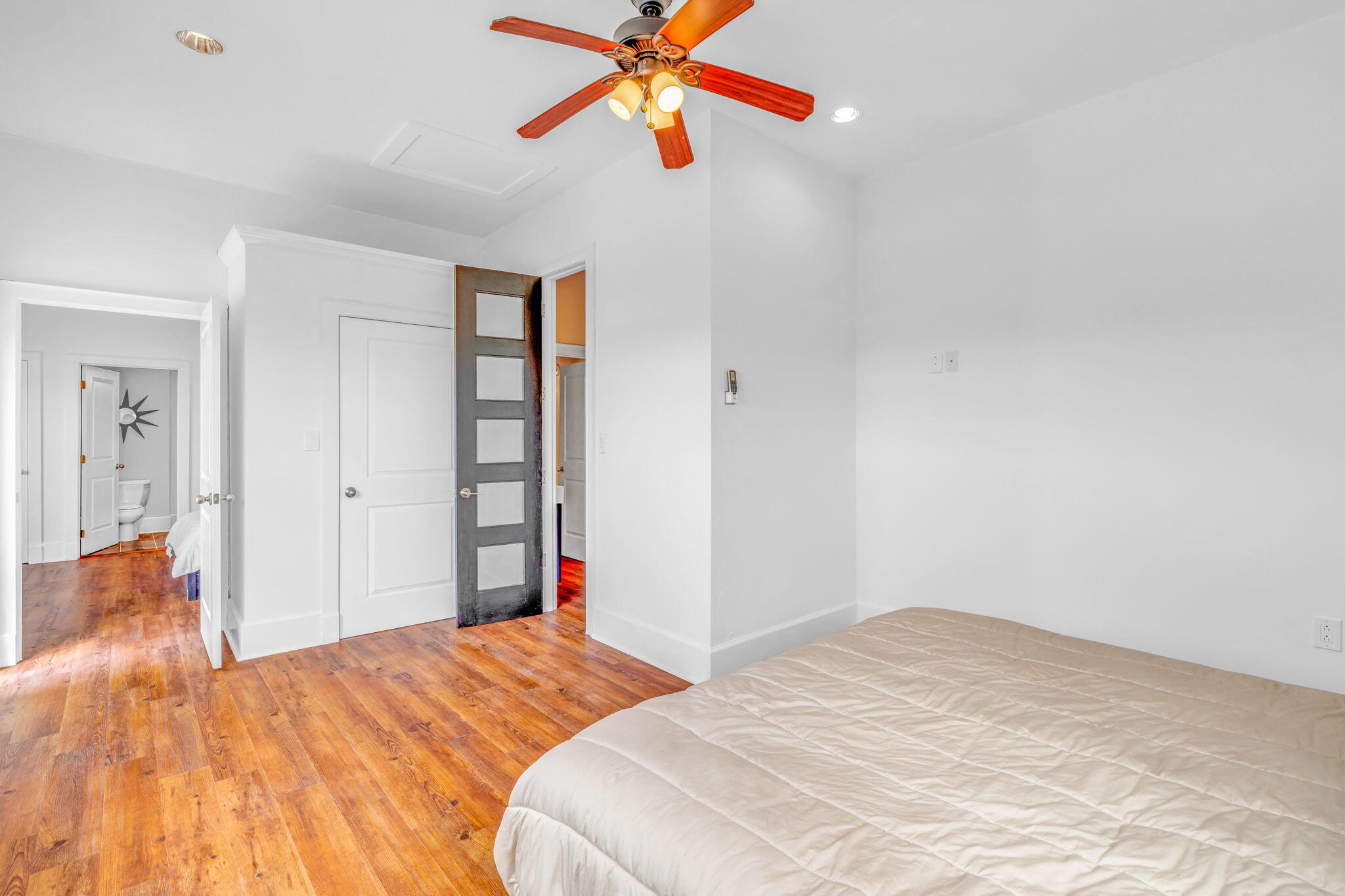 225 Colson Drive Cudjoe, FL 33042 - Photo 53 of 71 a bedroom with a bed and a chandelier