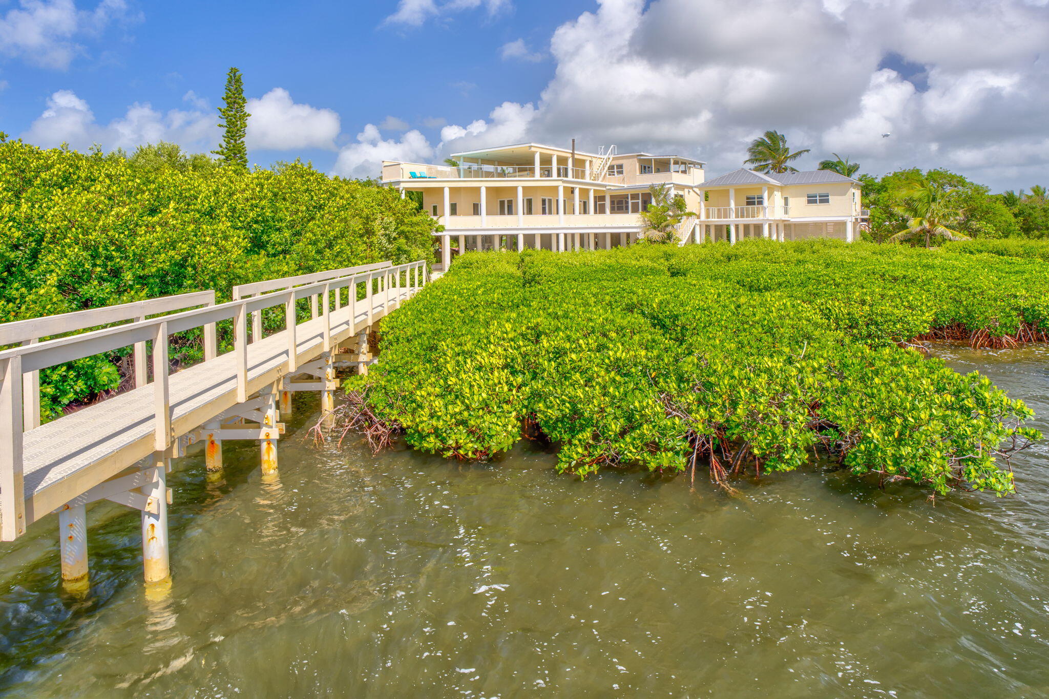 225 Colson Drive Cudjoe, FL 33042 - Photo 59 of 71 a view of a lake with a building in the background