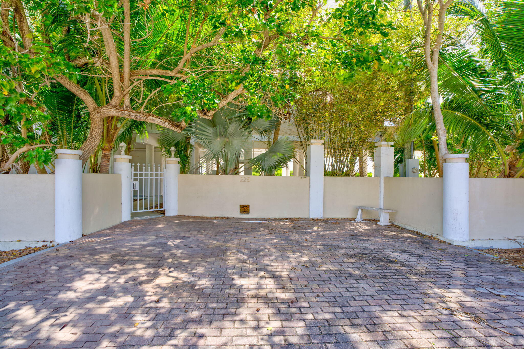 225 Colson Drive Cudjoe, FL 33042 - Photo 65 of 71 a view of white house with a tree and yard