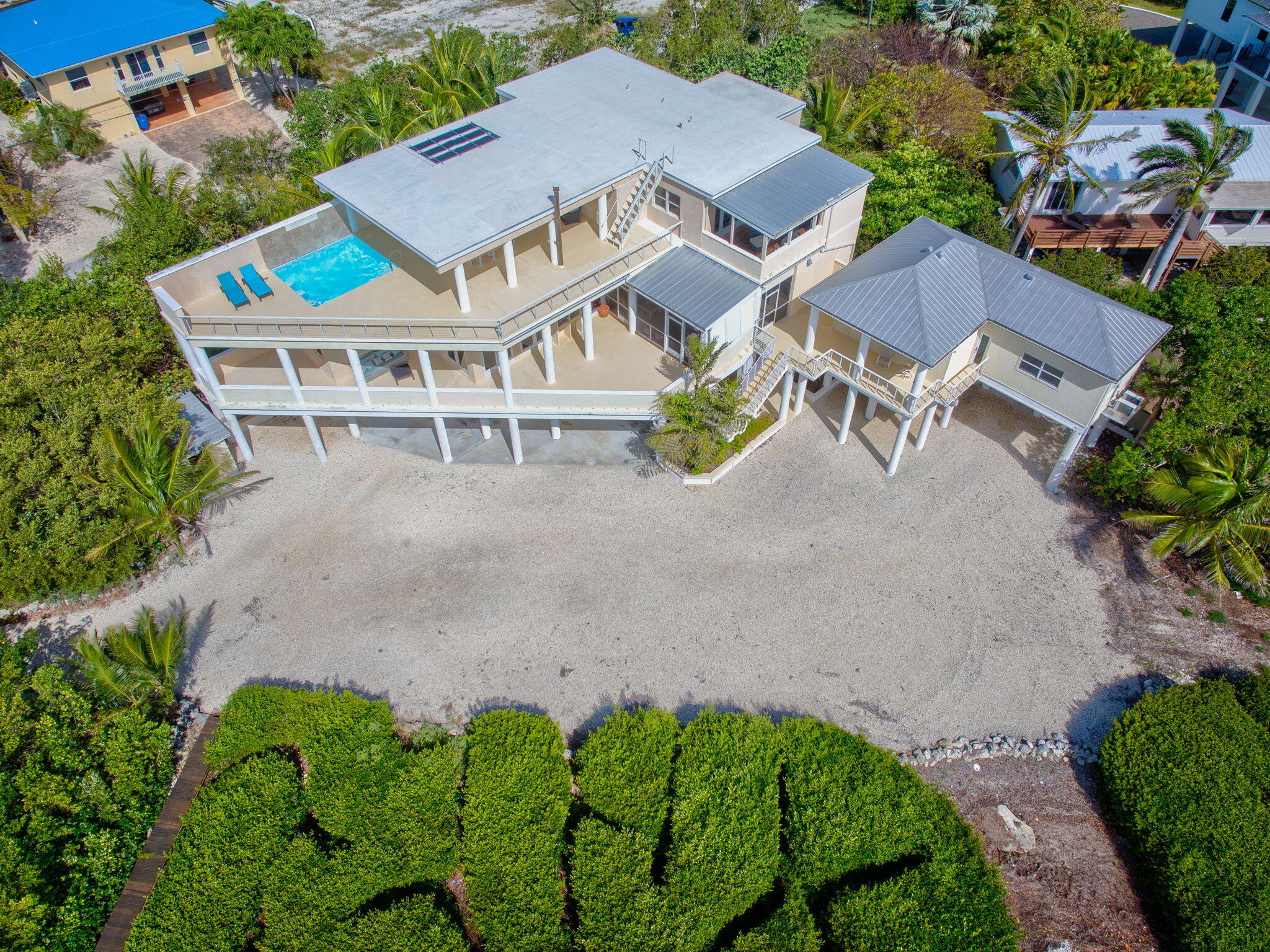 225 Colson Drive Cudjoe, FL 33042 - Photo 68 of 71 an aerial view of a house with a garden and mountain view