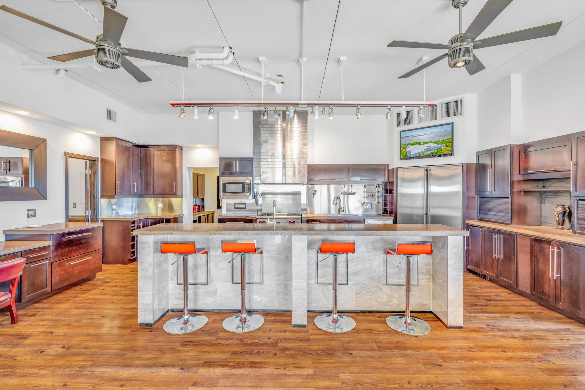 225 Colson Drive Cudjoe, FL 33042 - Photo 7 of 71 a kitchen with stainless steel appliances granite countertop a sink and a wooden floors