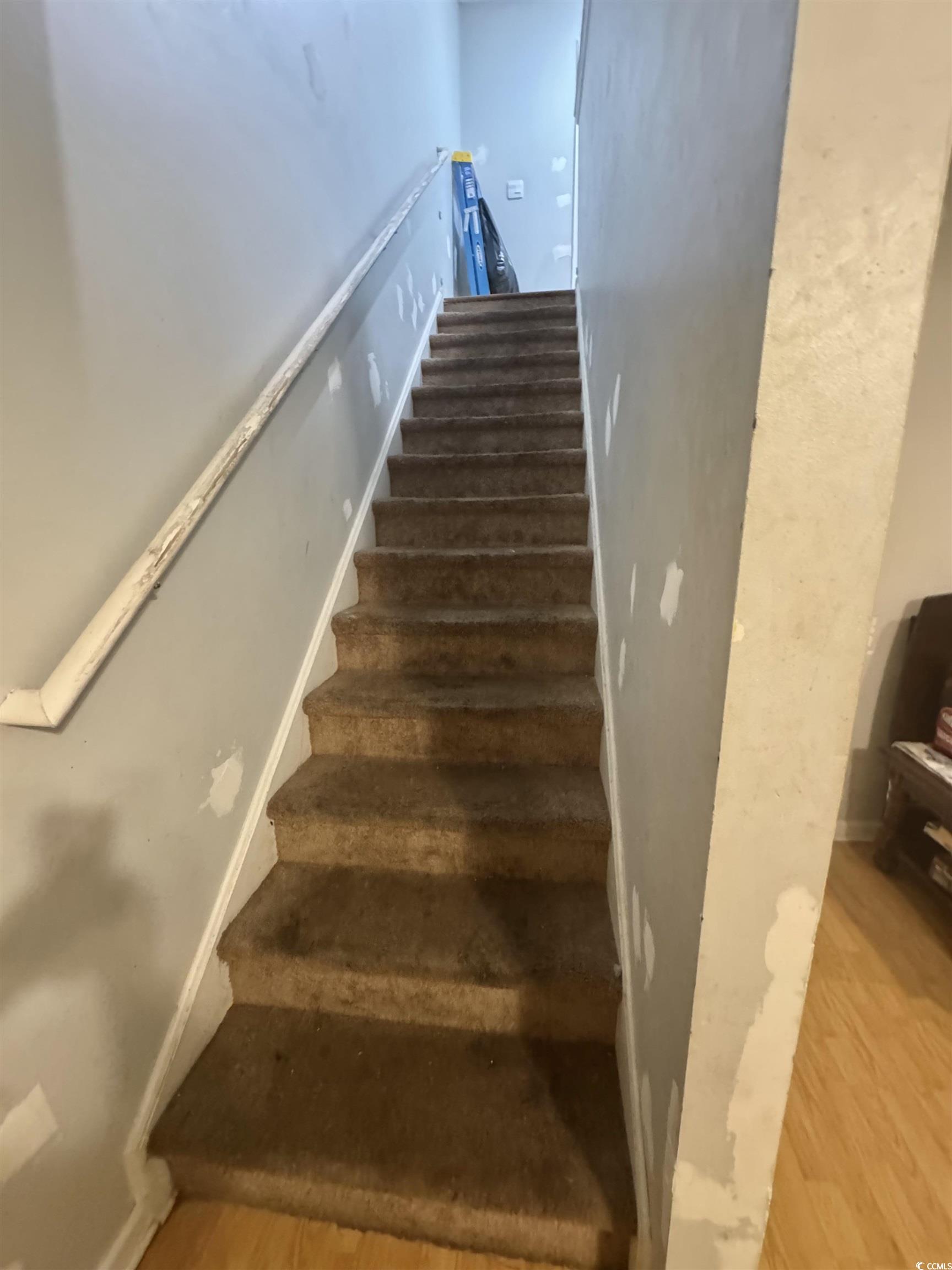 1207 Pinegrove Drive, Unit B Myrtle Beach, SC 29577 - Photo 6 of 16 Staircase with wood finished floors