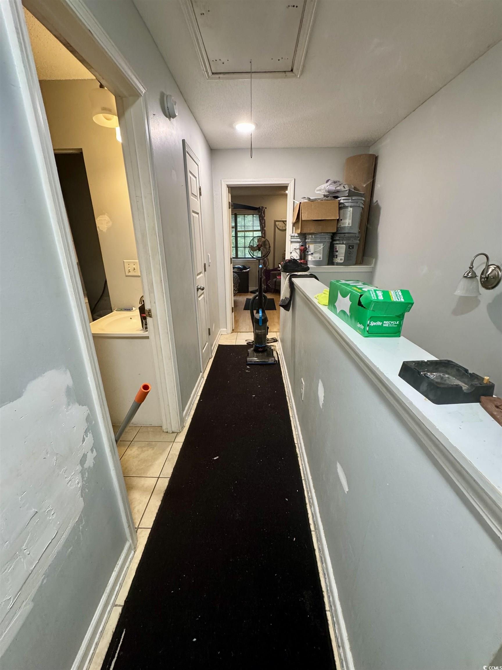 1207 Pinegrove Drive, Unit B Myrtle Beach, SC 29577 - Photo 7 of 16 Hall featuring attic access and light tile patterned floors