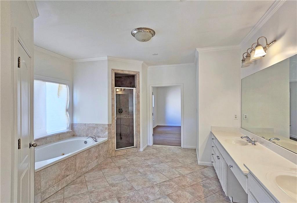 195 Beracah Walk Atlanta, GA 30331 - Photo 23 of 32 a large bathroom with a tub shower and sink