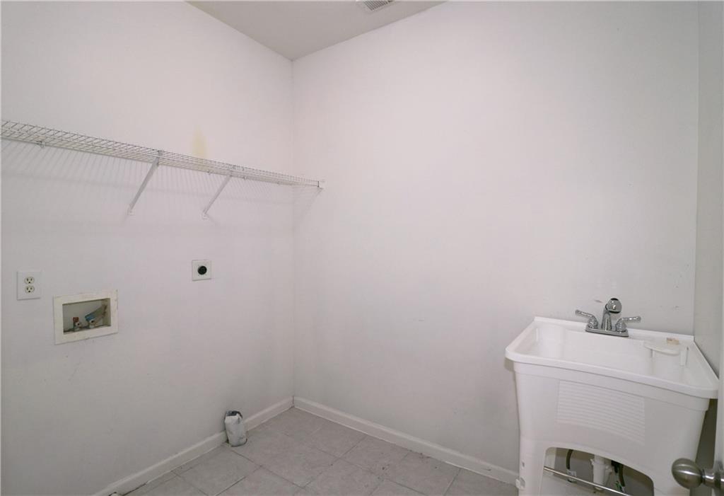 195 Beracah Walk Atlanta, GA 30331 - Photo 28 of 32 a bathroom with a sink and vanity