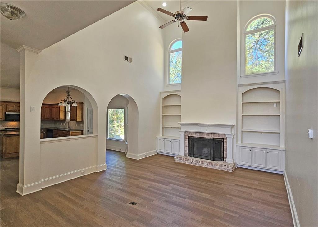 195 Beracah Walk Atlanta, GA 30331 - Photo 8 of 32 a view of empty room with a fireplace and wooden floor
