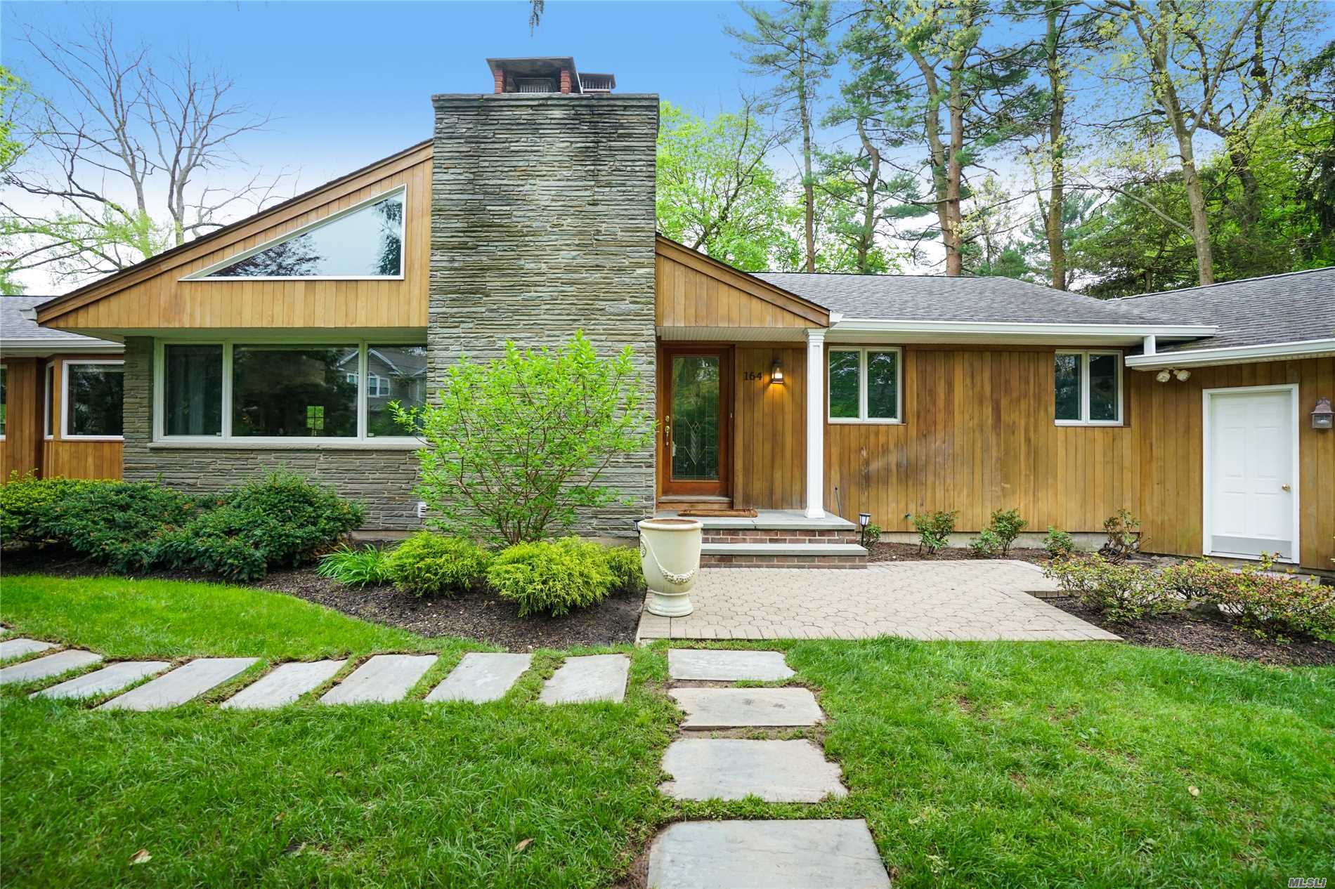 164 Cold Spring Road Syosset, NY 11791 - Photo 1 of 1 a front view of house with yard and green space