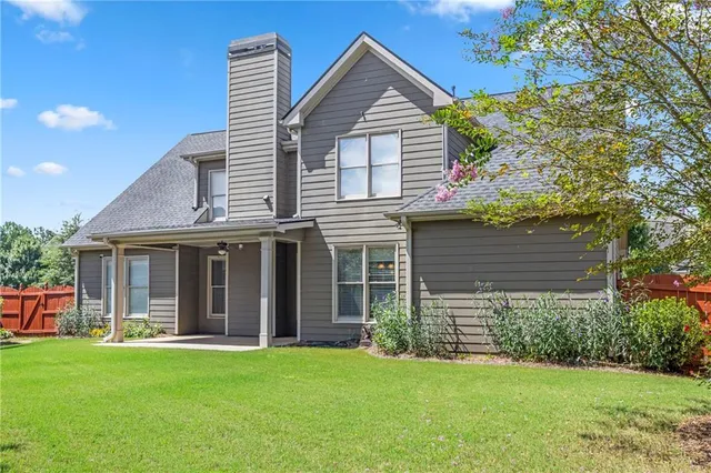 a view of a house with garden and yard