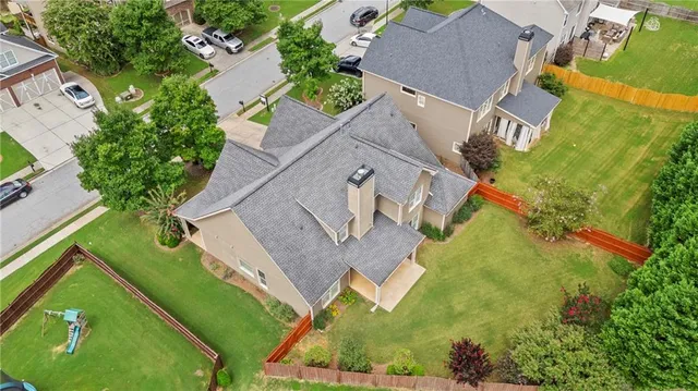 an aerial view of a house with a garden
