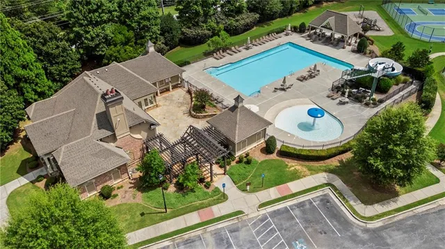 an aerial view of a house with garden space and street view