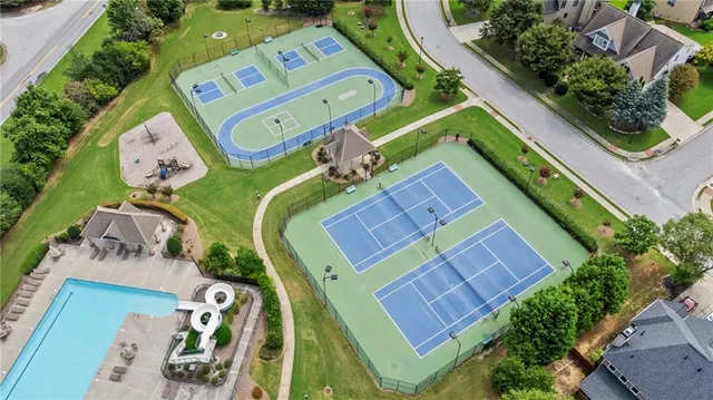 an aerial view of a swimming pool with outdoor space