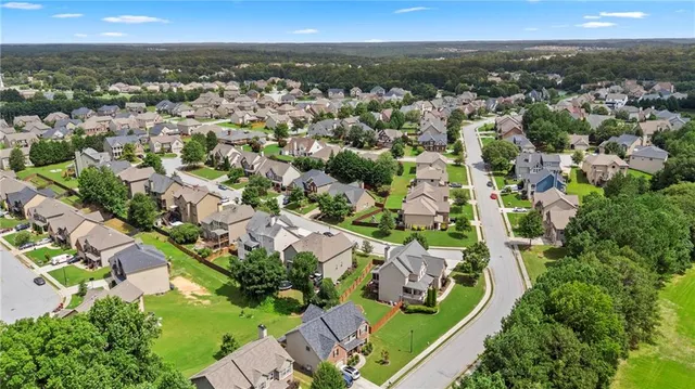an aerial view of residential houses with outdoor space