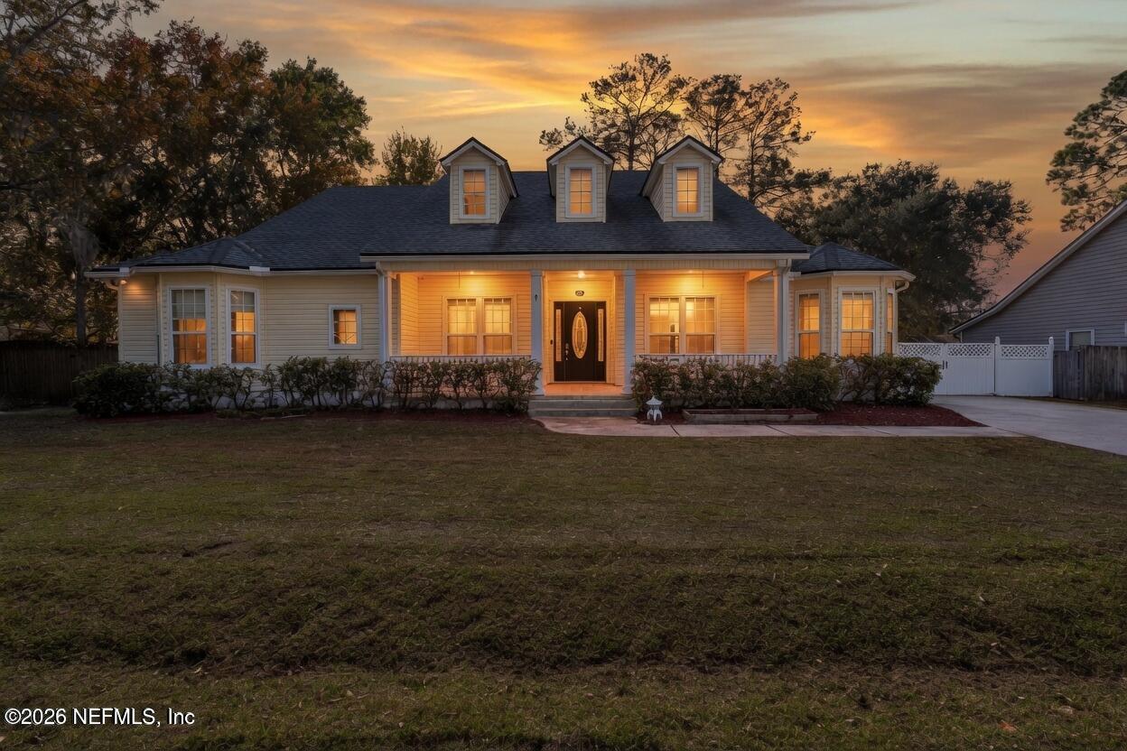 932 Clay Street Fleming Island, FL 32003 - Photo 1 of 50 a front view of house with yard and green space